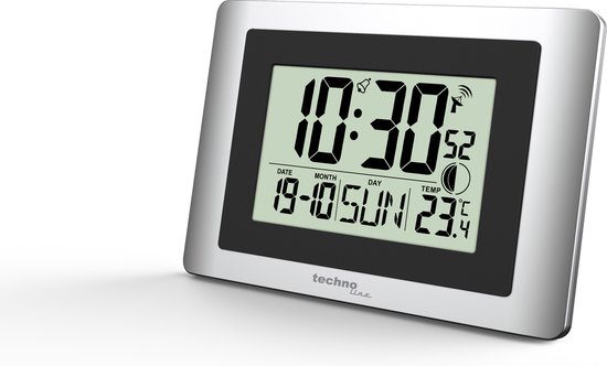 Digitale wandklok, zilverkleurig frame. Toont tijd 10:30, datum 19-10, dag ZON en temperatuur 23.4°C.