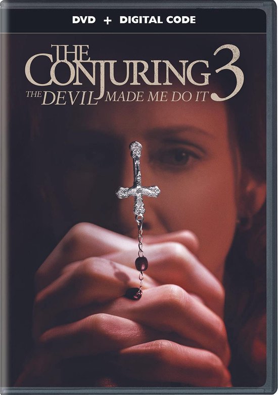 DVD hoes van The Conjuring 3: The Devil Made Me Do It. Een meisje bidt met een kruisje.