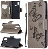 Voor Galaxy A10s Twee vlinders reliëfpatroon horizontaal Flip lederen tas met houder & kaartsleuf & portemonnee & lanyard (grijs)