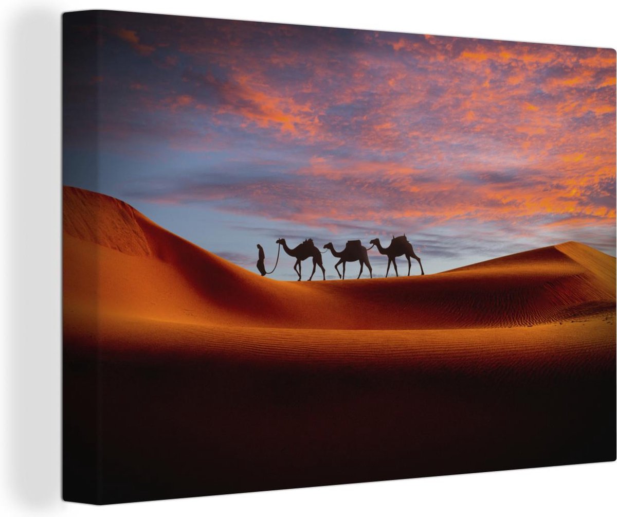 Canvas Schilderijen - Man in het Midden-Oosten met kamelen - 140x90 cm - Wanddecoratie