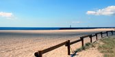 Tuinposter - Zee / Water - Strand in wit / grijs / zwart / blauw / groen / bruin / beige - 80 x 160 cm