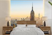 Behang - Fotobehang Zonsondergang skyline van New York met het Empire State Building - Breedte 280 cm x hoogte 280 cm