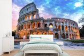 Behang - Fotobehang Colosseum in Rome tijdens de schemering - Breedte 600 cm x hoogte 400 cm