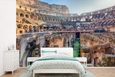 Behang - Fotobehang Het Colosseum in Rome van binnen bekeken - Breedte 600 cm x hoogte 400 cm