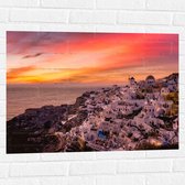 Muursticker - Uitzicht over Klassieke Griekse Stad tijdens de Zonsondergang - 80x60 cm Foto op Muursticker