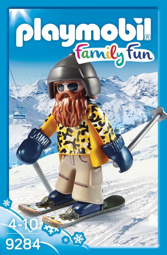 Playmobil skiër met baard, skibril, gele jas met luipaardprint, beige broek en blauwe wanten, op ski's.