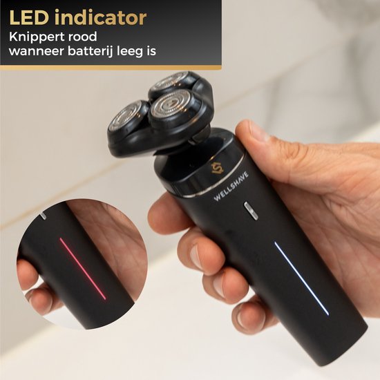 Wellshave scheerapparaat met LED indicator die rood knippert bij lege batterij.