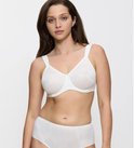 Soutien-gorge blanc avec un motif ondulé, porté sur un mannequin.