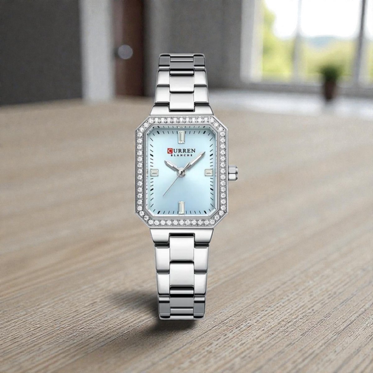 CURREN 9102 Zilverkleurig met Lichtblauwe Wijzerplaat Dameshorloge met Kristalrand en Lichtgevende Wijzers