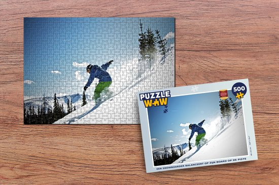 Puzzle Un snowboard regarde les sommets enneigés avec sa planche - Puzzle -  Puzzle