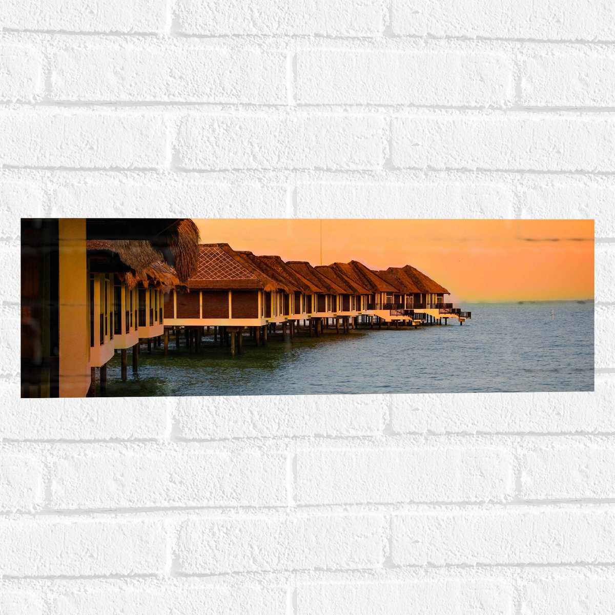 Muursticker - Huisjes op Palen in de Zee - 60x20 cm Foto op Muursticker