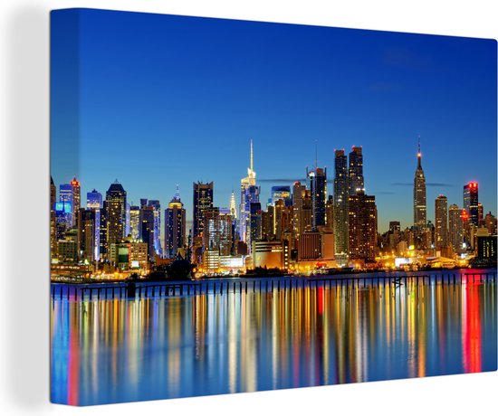 Canvas Schilderij Skyline is 's nachts New York - 120x80 cm - Wanddecoratie