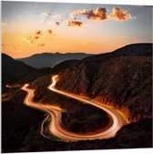 WallClassics - Acrylglas - Verlichte Weg over Berg met Zonsondergang - 100x100 cm Foto op Acrylglas (Met Ophangsysteem)