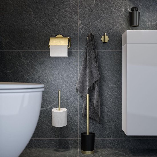 Salle de bain avec accessoires Tiger Tune noirs et dorés : dévidoir de papier toilette, crochet, brosse à cuvette.