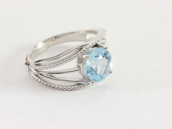 Opengewerkte zilveren ring met blauwe topaas - maat 16.5 | bol.com