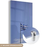 MuchoWow® Glasschilderij 80x120 cm - Schilderij acrylglas - Gescheurde Griekse vlag die wappert - Foto op glas - Schilderijen