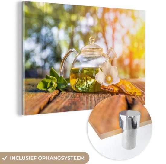 MuchoWow® Glasschilderij 60x40 cm - Schilderij acrylglas - Een doorzichtige theepot met thee in het zonlicht - Foto op glas - Schilderijen