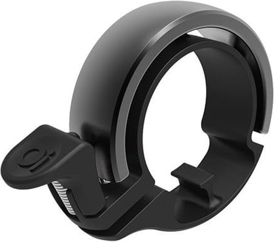 Zwarte Knog Oi fietsbel met compact aluminium design en zilveren accents.