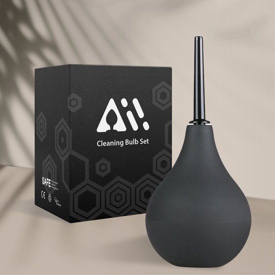 Zwarte reinigingsbulb en verpakking met hexagonpatroon op een neutrale achtergrond.