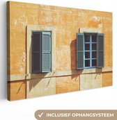 Canvas Schilderij Twee ramen met luiken tegen een oranje muur in Rome - 120x80 cm - Wanddecoratie