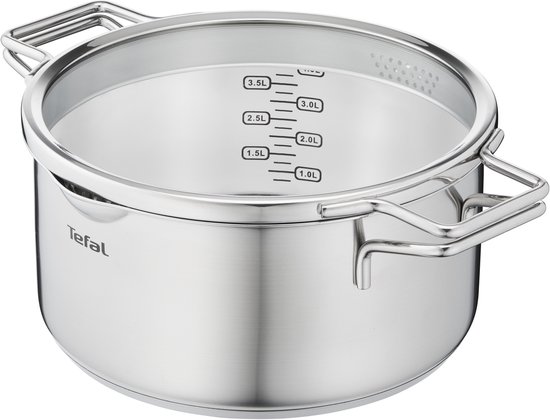 RVS pan van Tefal met dubbele handvatten en een glazen deksel met maataanduiding.