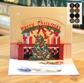 3D popupkaart - Kerstkaart Kerstmis Knus bij de open haard Kerstboom en cadeautjes pop-up wenskaart met berichtenpaneel - incl. envelop & 8 sluitzegels - Complete Set
