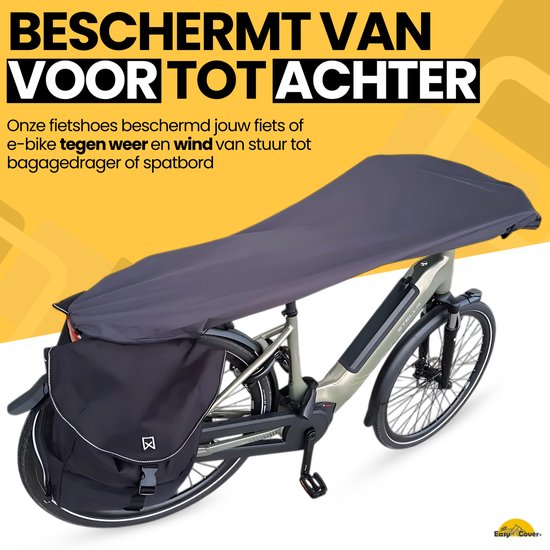 Grijze hoes over een groene e-bike, van stuur tot bagagedrager.