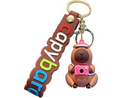 foto van Leuke Capybara-sleutelhanger, Capybara-figuur, autosleutelhanger, grappige Capybara-poppensleutelhanger, 6,6 cm, draagbare capibara-zak-charmje, fotocamera