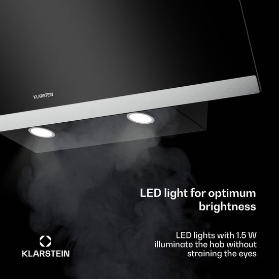Onderkant van een zwarte schuine afzuigkap met LED-verlichting die rook verlicht.