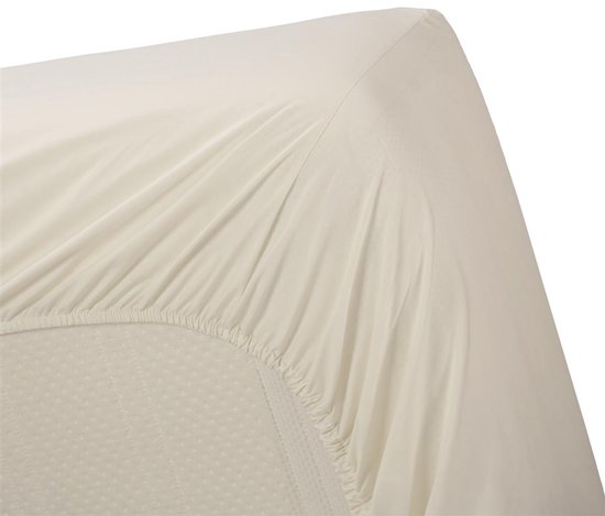 Crème hoeslaken met een licht gestippeld patroon op de matras.