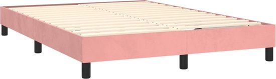 Cadre de lit rose avec sommier à lattes en bois et pieds noirs.
