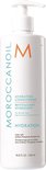 Witte Moroccanoil Hydrating Conditioner fles met pomp en oranje M-logo. Tekst in Engels, Frans.