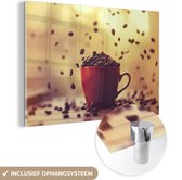 MuchoWow® Glasschilderij 60x40 cm - Schilderij acrylglas - Vallende koffiebonen in een koffiekop - Foto op glas - Schilderijen