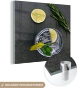 MuchoWow® Glasschilderij 90x90 cm - Schilderij acrylglas - Cocktail - Glas - Limoen - Foto op glas - Schilderijen