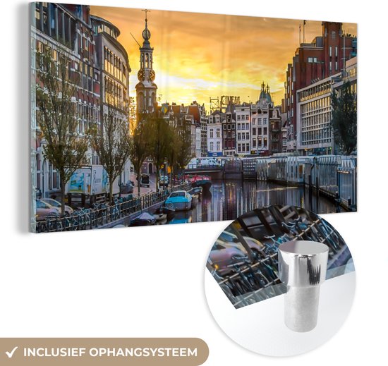 MuchoWow® Glasschilderij 40x20 cm - Schilderij acrylglas - Zonsondergang boven de Munttoren in Amsterdam - Foto op glas - Schilderijen