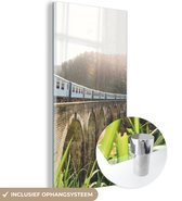 MuchoWow® Glasschilderij 60x120 cm - Schilderij acrylglas - Een trein over een brug - Foto op glas - Schilderijen