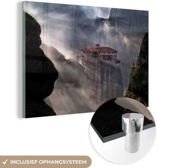 MuchoWow® Glasschilderij 90x60 cm - Schilderij acrylglas - Prachtige zonnestralen door de wolken bij de Meteora kloosters in Griekenland - Foto op glas - Schilderijen