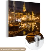 MuchoWow® Glasschilderij 20x20 cm - Schilderij acrylglas - Groningen - Nacht - Lichten - Foto op glas - Schilderijen