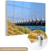 MuchoWow® Glasschilderij 180x120 cm - Schilderij acrylglas - Oosterschelde in Zeeland met windmolens vanaf duinen - Foto op glas - Schilderijen