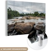 MuchoWow® Glasschilderij 150x100 cm - Schilderij acrylglas - Rotsen in de rivier van Suriname - Foto op glas - Schilderijen