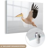 MuchoWow® Glasschilderij 180x120 cm - Schilderij acrylglas - Roze pelikaan tijdens de vlucht - Foto op glas - Schilderijen