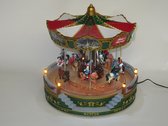 Kerstdorp - Kersthuis - Carrousel - Draaimolen - Merry Go Round - Verlichting - Muziek - Groen / Wit