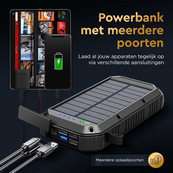 Zwarte zonne-powerbank met meerdere poorten, laadt telefoon en tablet op via USB.