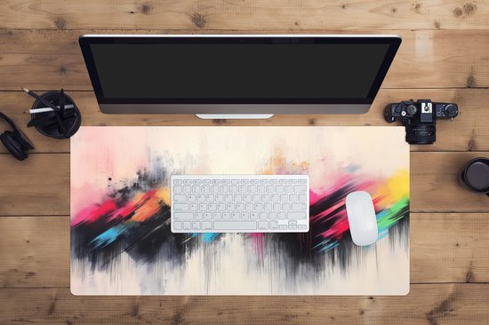 XXL muismat met abstracte kleurexplosie van zwart, roze, blauw en geel op een lichte achtergrond.