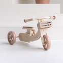 Houten loopfiets van het merk Babiem in de kleuren beige en taupe. Met een mandje aan de voorkant en het logo 'babiém' op het frame.