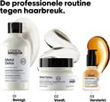 Set L'Oréal Metal Detox producten: shampoo, masker en serum in witte verpakkingen.