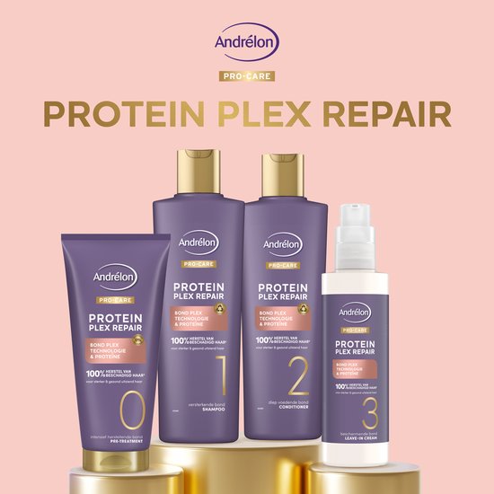 Drie paarse Andrélon flessen (shampoo, conditioner) en een witte sprayfles op gouden sokkels.