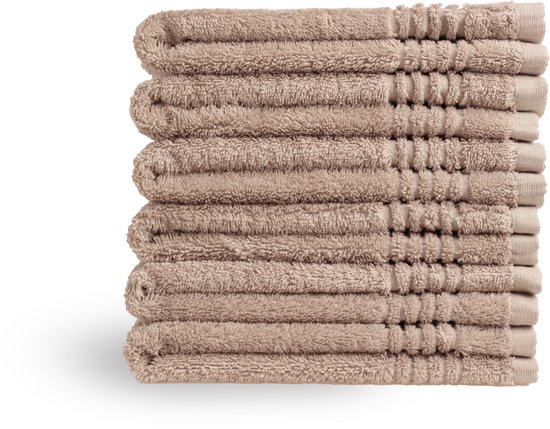 Stapel taupe gastendoekjes met ribbeldetails aan de randen.