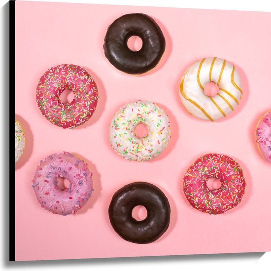 Canvas - Verschillende Smaken Donuts op Pastelroze Achtergrond - 100x100 cm Foto op Canvas Schilderij (Wanddecoratie op Canvas)