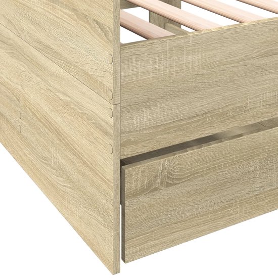 Dichtbij detail van het houten dagbed met lades in eikenkleur.